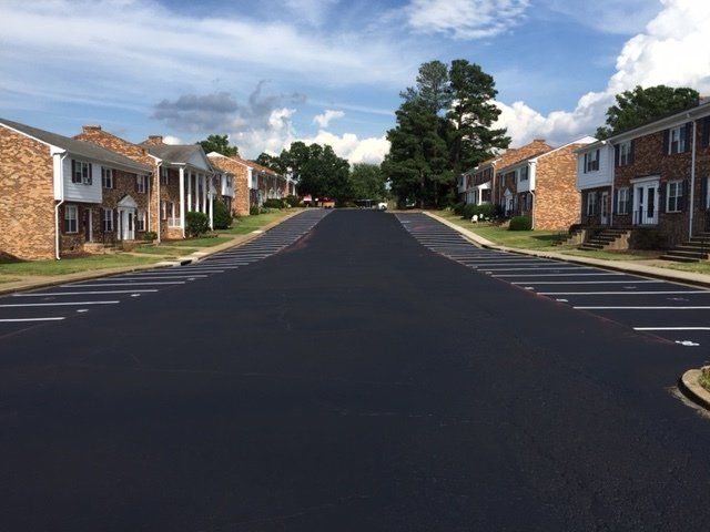 A row of apartment buildings along a residential street