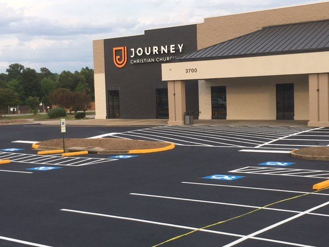 A large building with the word journey on it