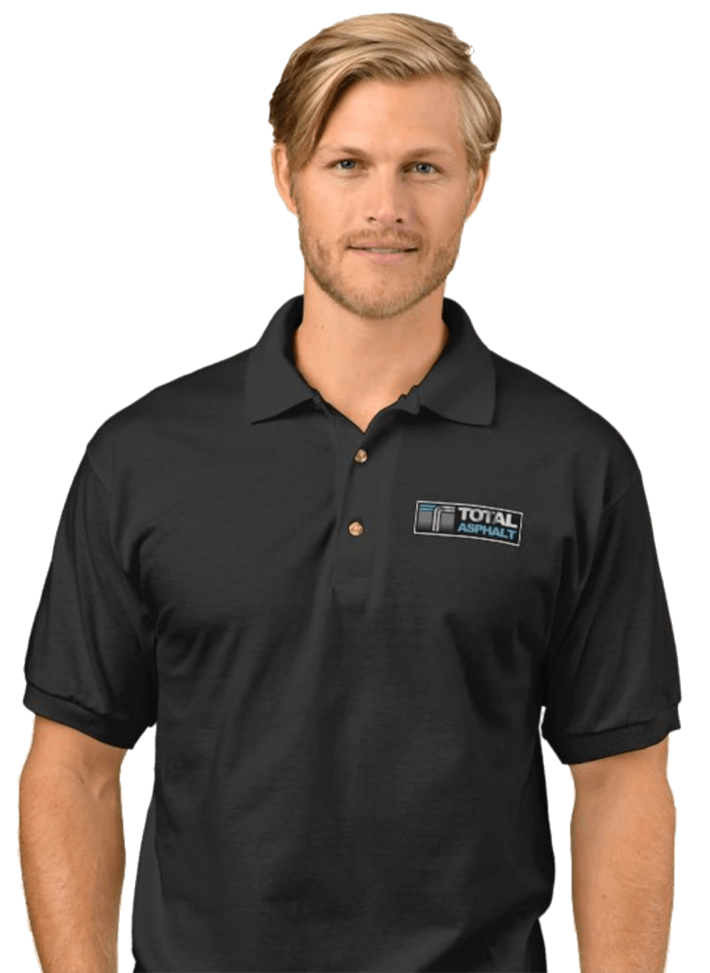 A man wearing a black polo shirt with the word total on the front