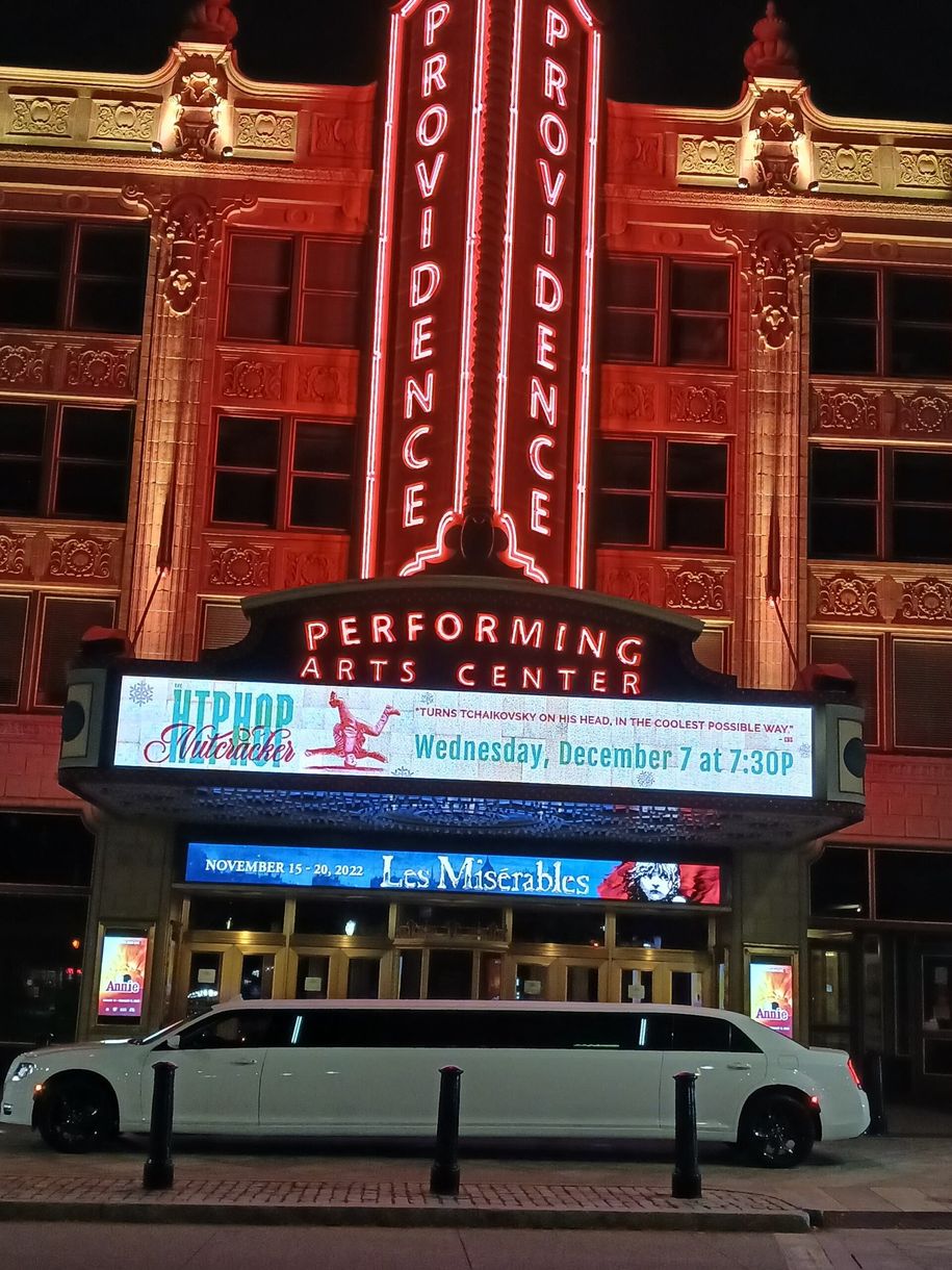 A limousine is parked in front of the providence performing arts center