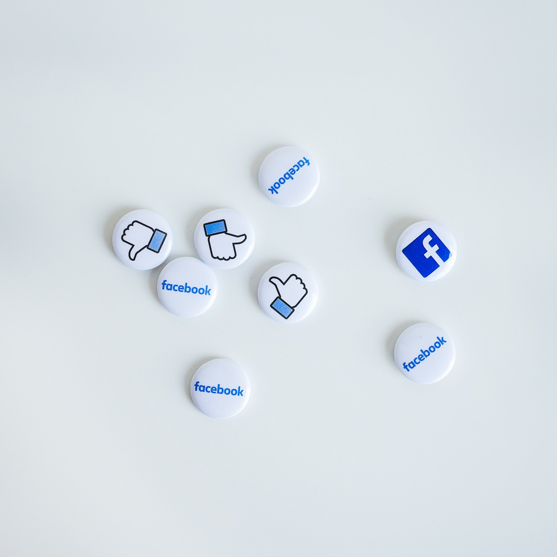an image representing social media management with FB logo and emoticons