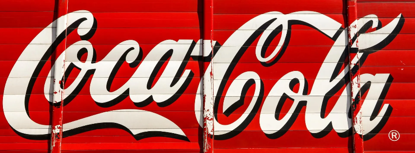 an image of the coca cola logo on a wall representing targeted ad placement