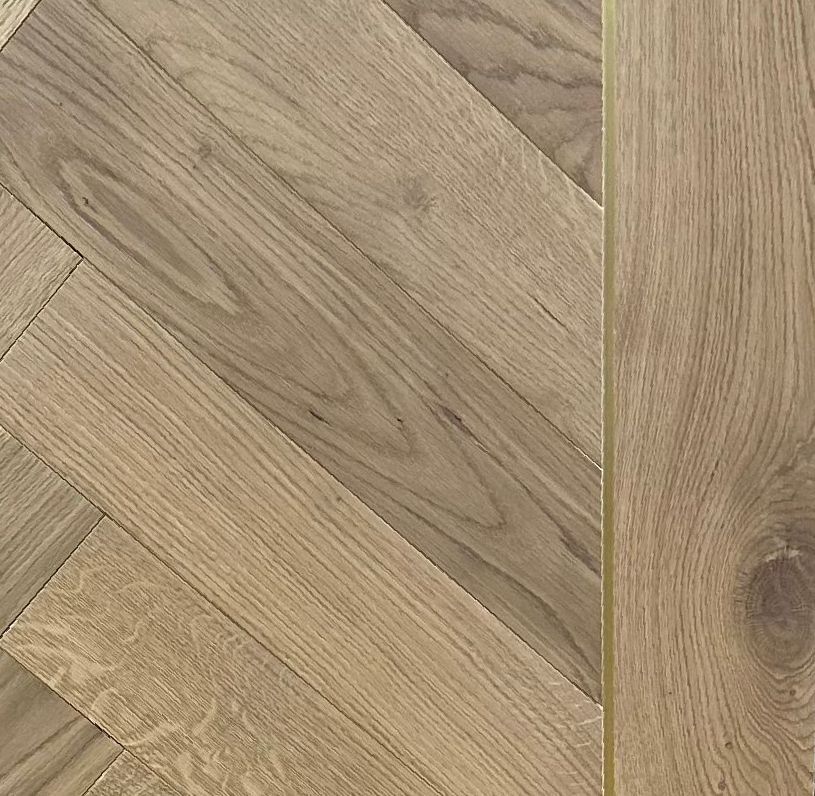 Herringbone floor with metal inlay border.