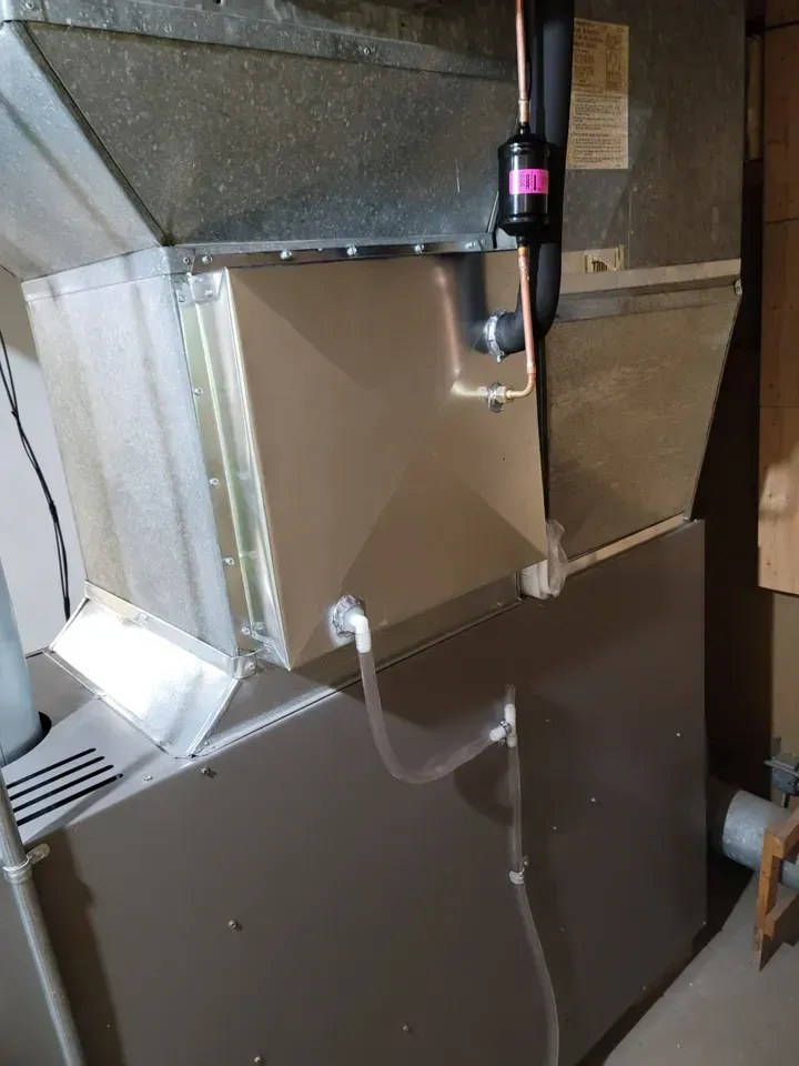 A close up of an air conditioner in a room.