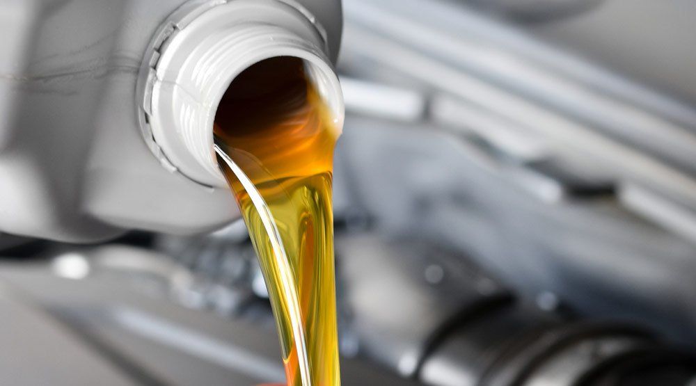 Pouring Motor Oil — Gearbox Manufacturers in Australia