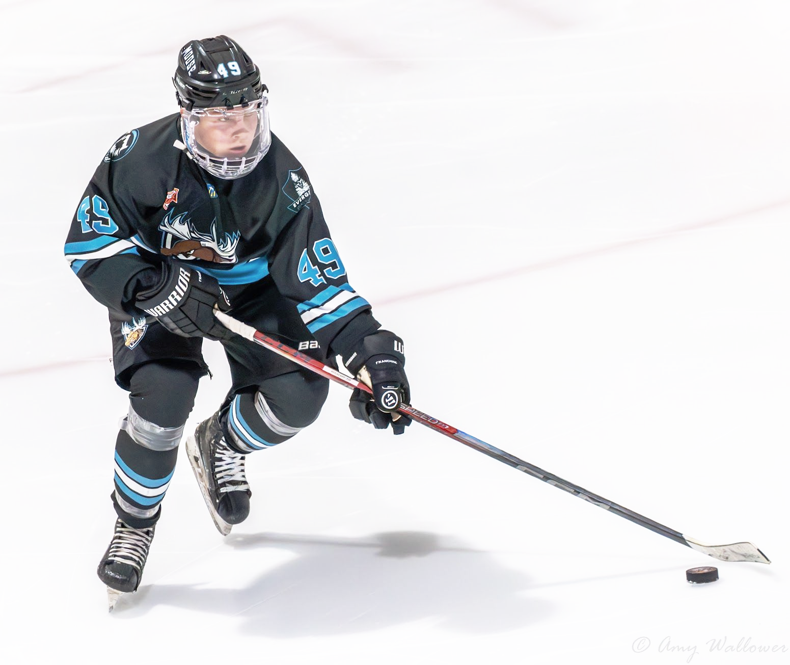 49 Skates the puck up the ice.