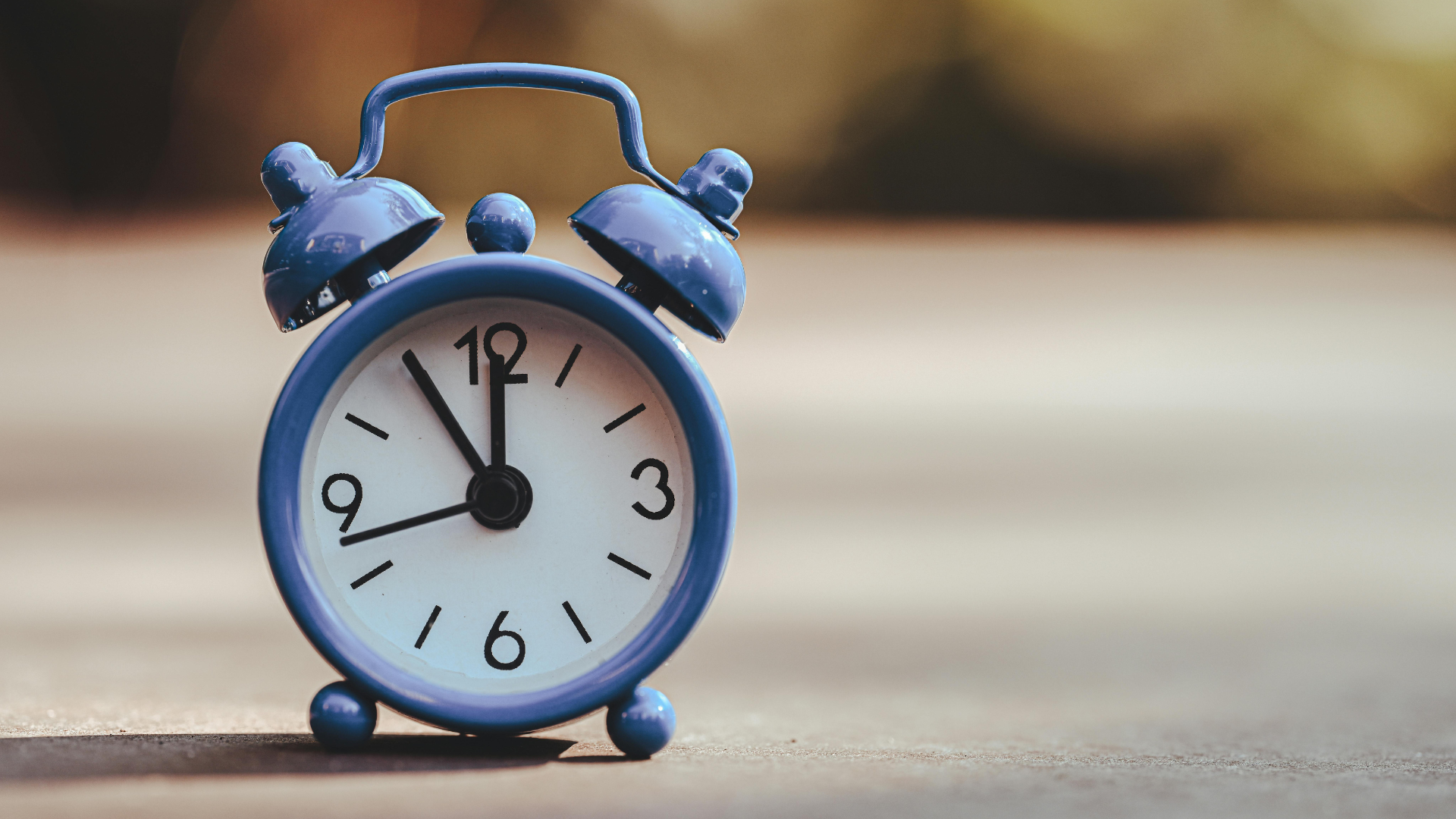 Woman and child waving goodbye through a window to another woman.