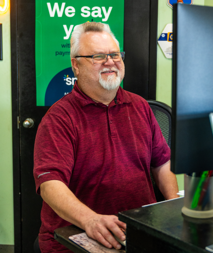 Staff member at receptionist desk in Olathe, KS | Smith Specialty Automotive
