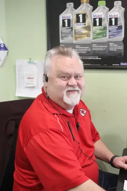 A man wearing a red shirt with the number 1 on it