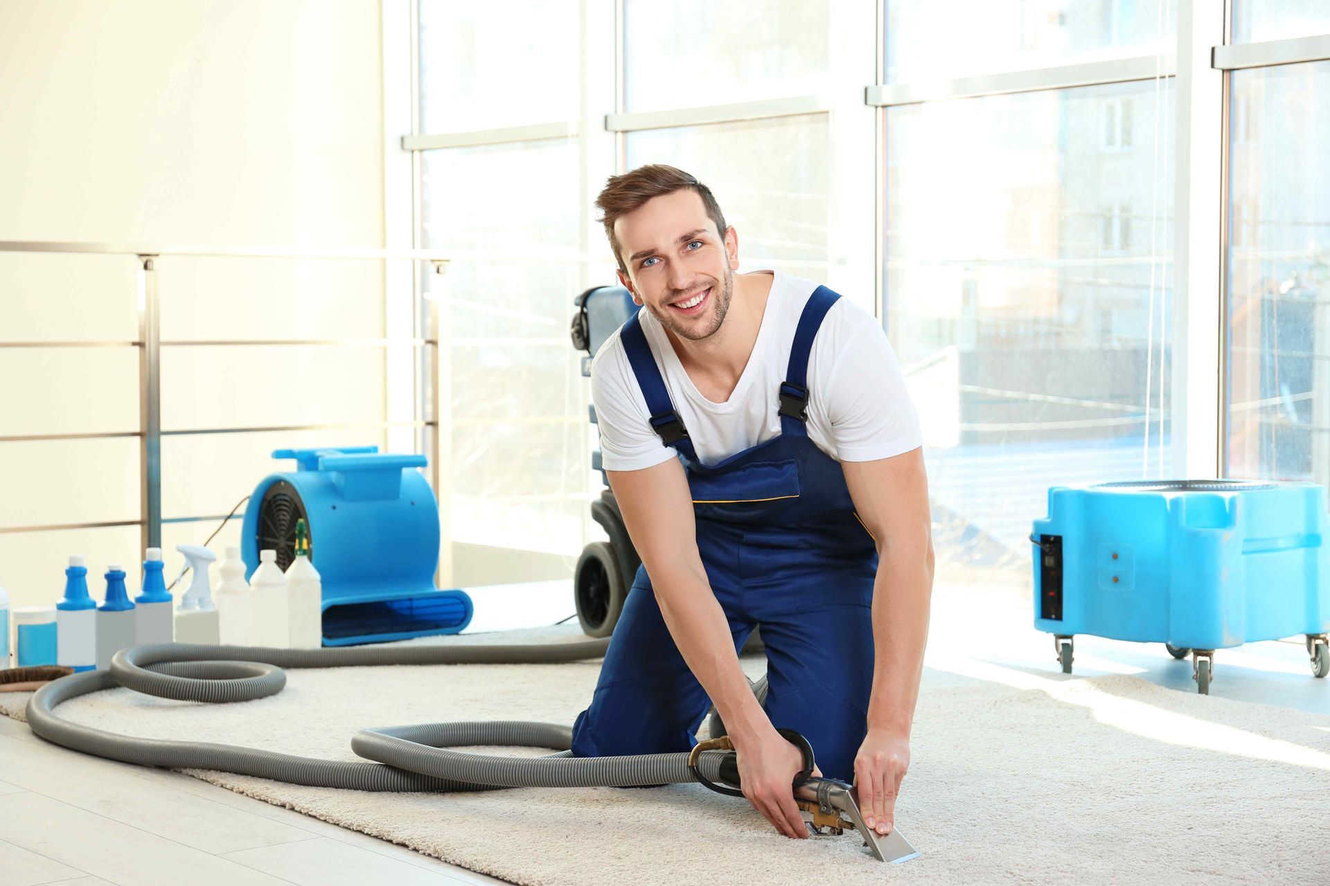 Worker Cleaning Area Rug