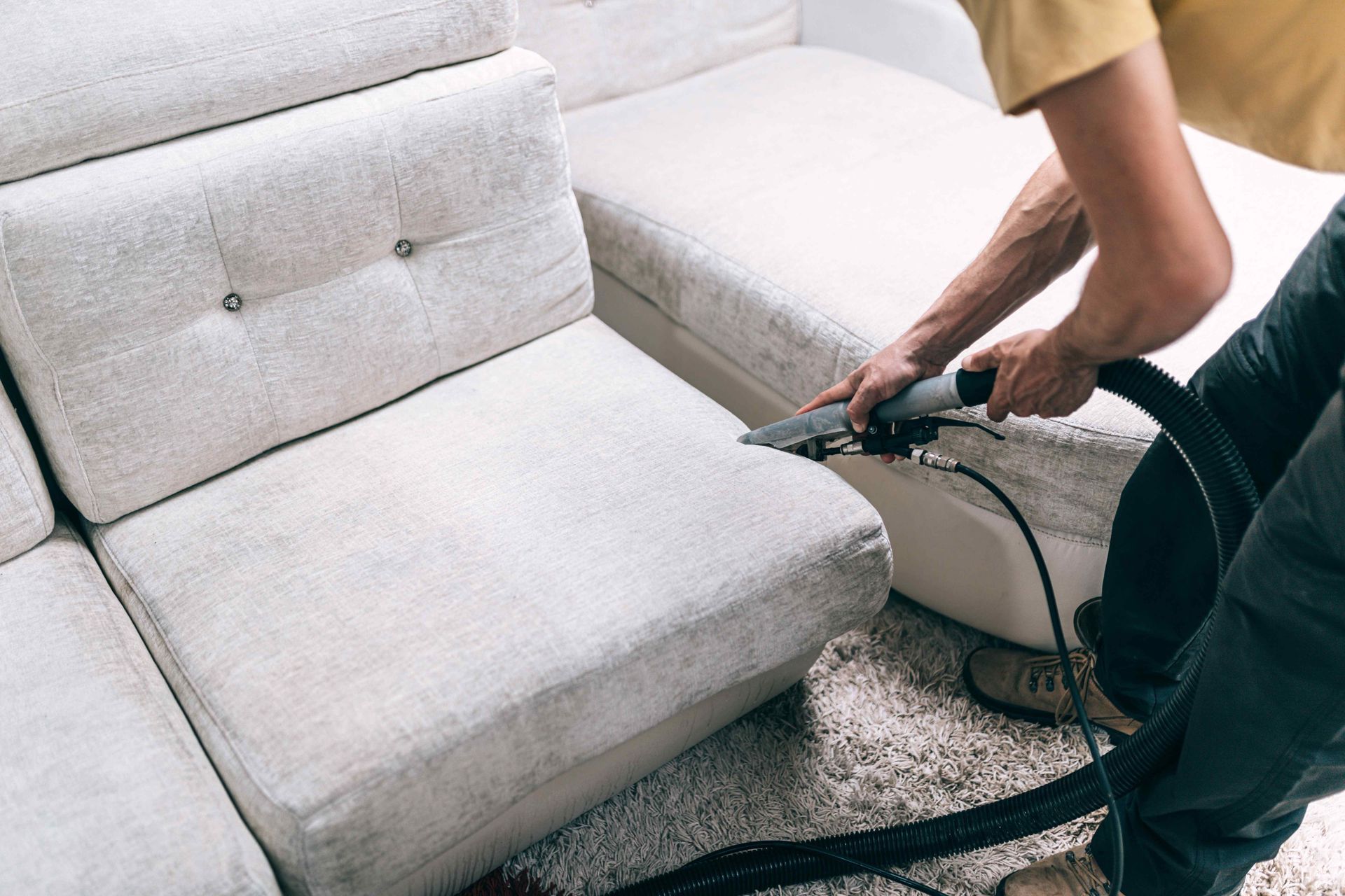 Sofa Cleaning by Henderson Cleaning Co. worker