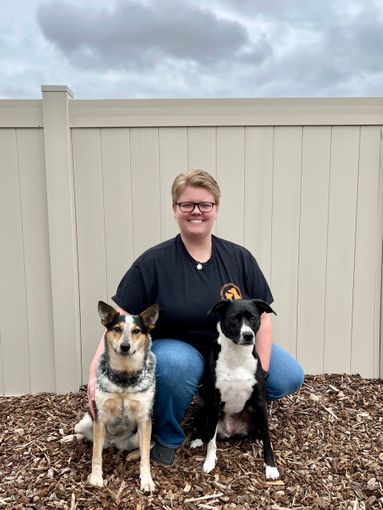 Picture of Owner and Lead trainer with her two dogs