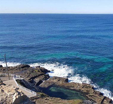 Blue Sea And Rocky Shore — Hose & Fitting Solutions In Morisset, NSW