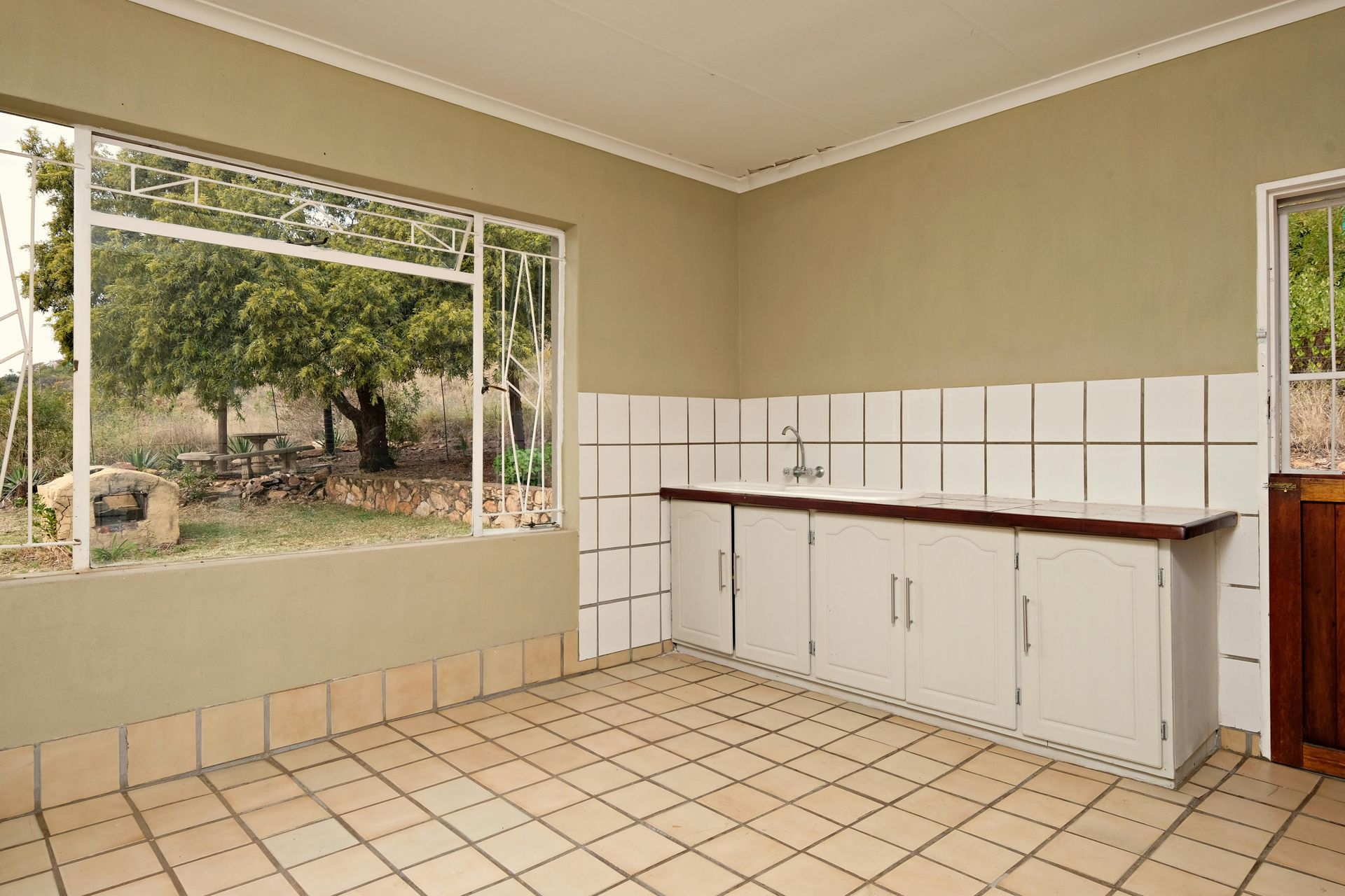 a man is installing a counter top in a kitchen .