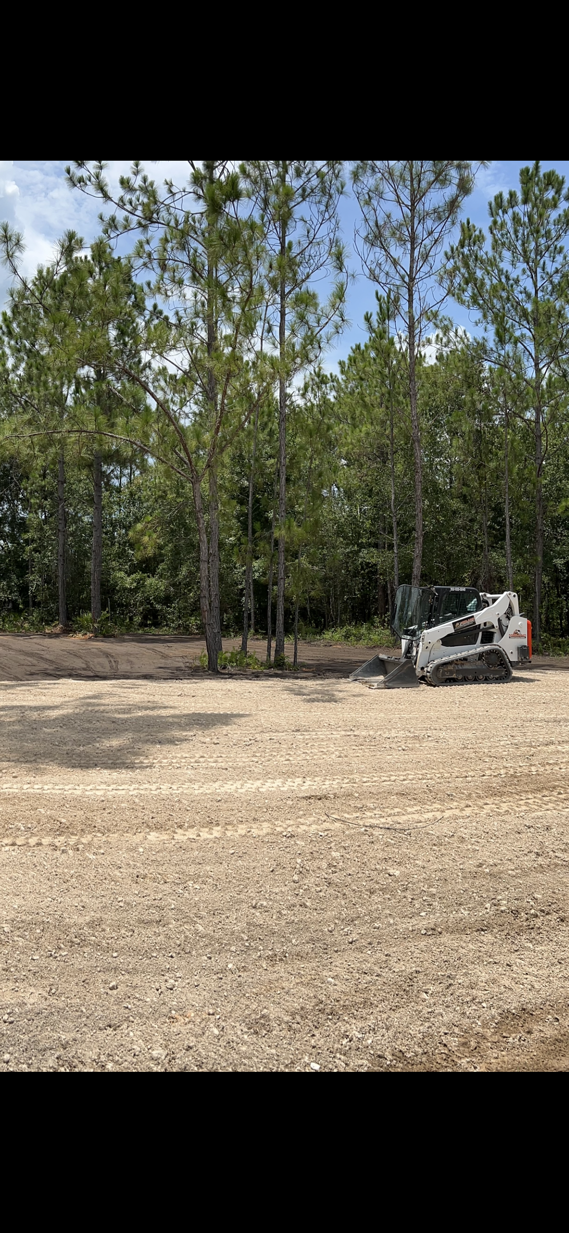 A bulldozer is moving dirt on a construction site.