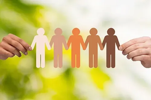 A group of people are holding hands in a row.