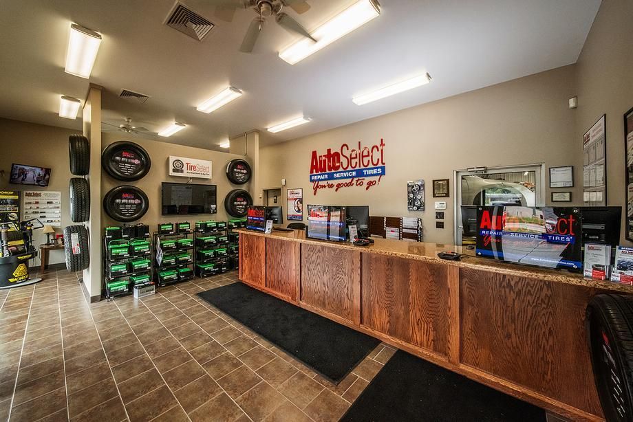 A large room with a wooden counter in the middle of it.
