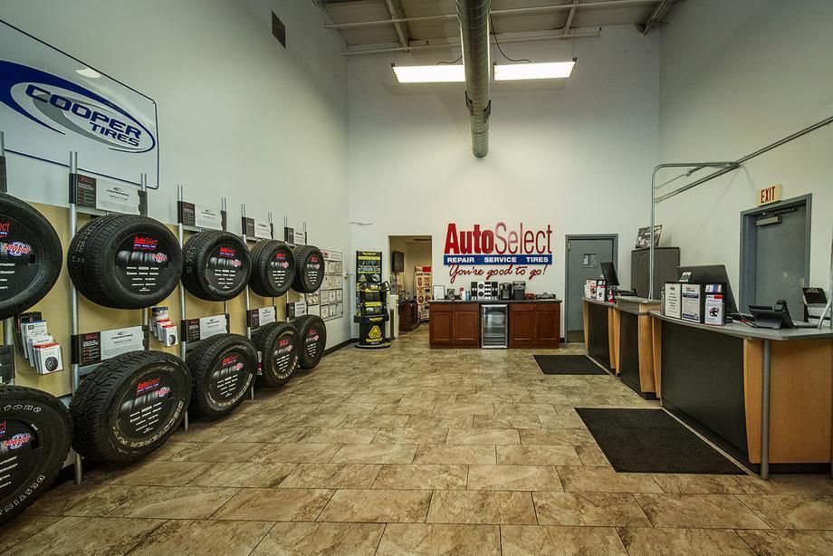 A store filled with lots of tires and a sign that says autoselect