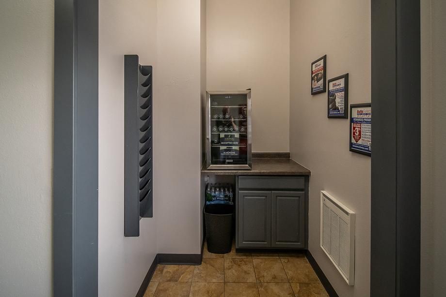 There is a refrigerator in the middle of the room.