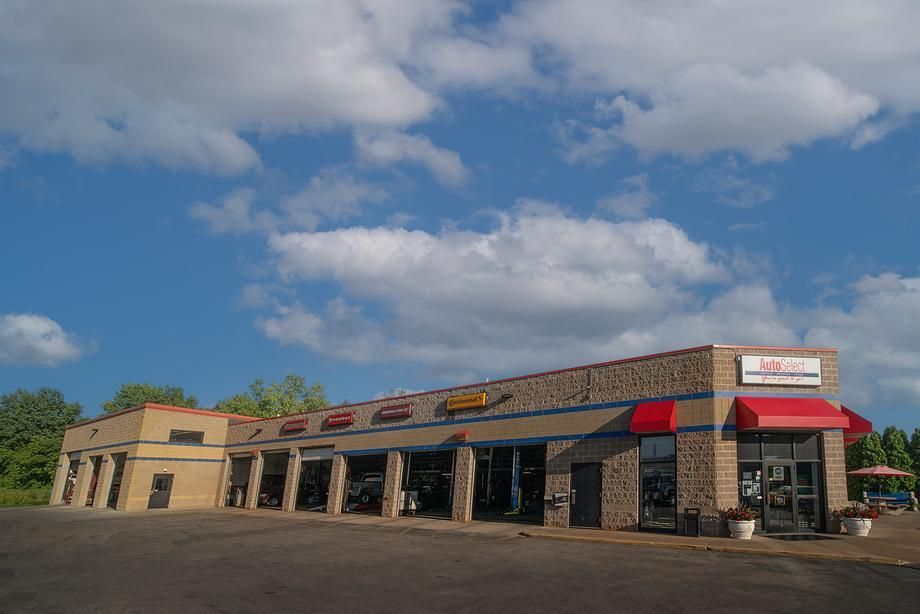 A large building with a red awning on the side of it