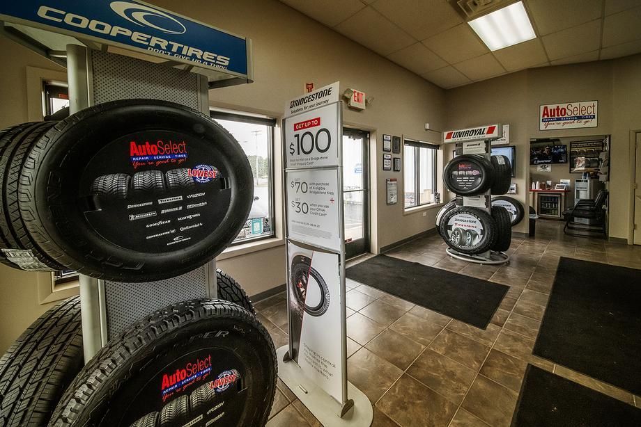 A store filled with lots of tires and signs.