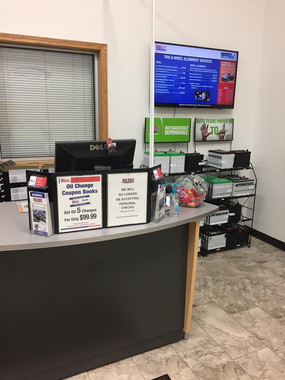 A counter in a store with a dell computer on it.