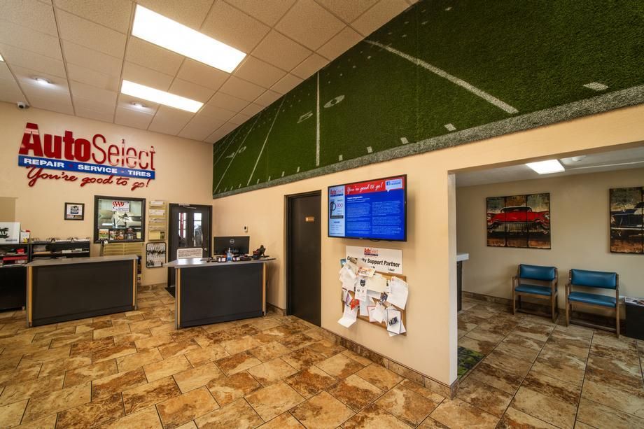 The inside of a car dealership with a sign that says autoselect