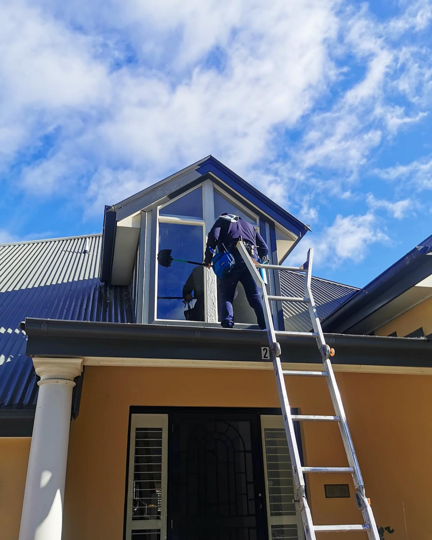 Man Cleaning External Home Windows - Window Cleaning in Southern Highlands, NSW