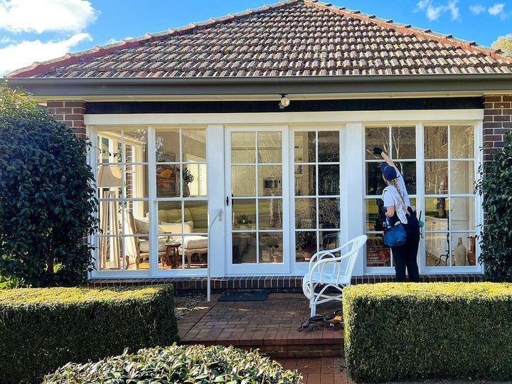 Worker Cleaning External Windows - Window Cleaning in Southern Highlands, NSW