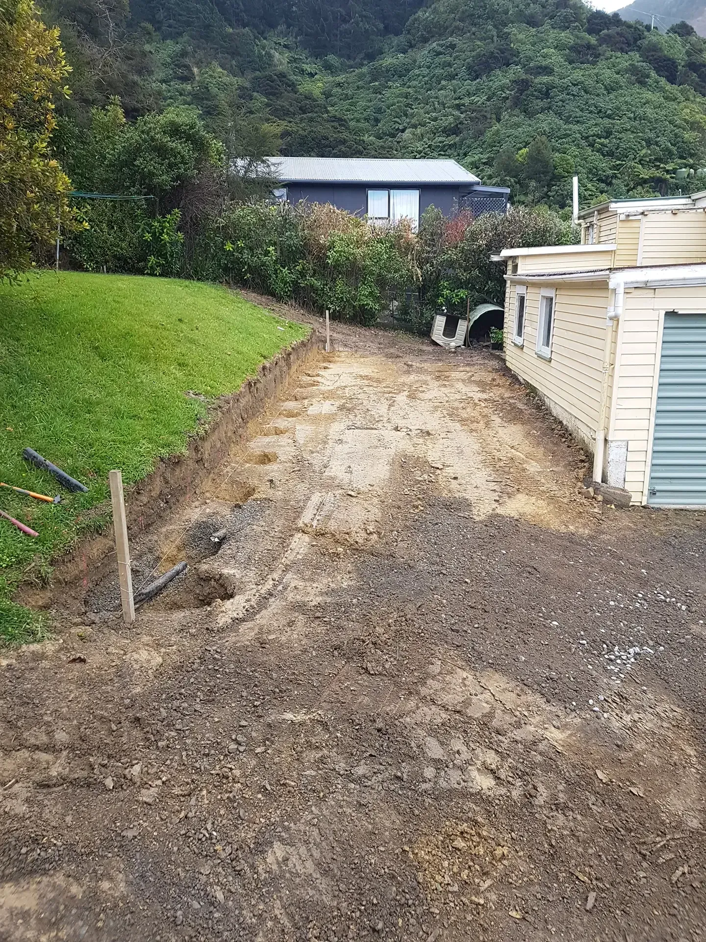 Hakahaka Bay Retaining Wall and Driveway Job by Bobcat Tipper Services in Marlborough, New Zealand.