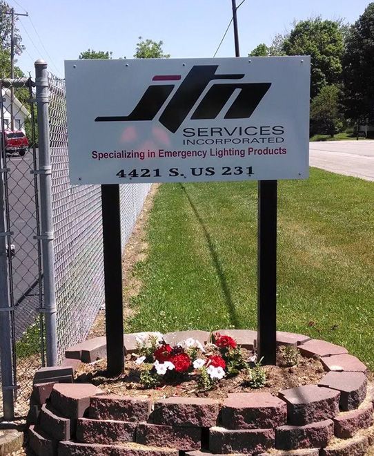 Sign for JTN Services Incorporated, specializing in emergency lighting products, 4421 S. US 231.