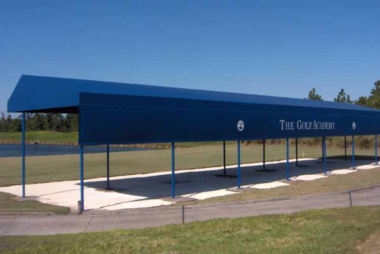Blue canopy at The Golf Academy on a sunny day.