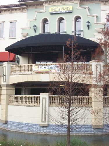 Urban Flats restaurant with a black awning and