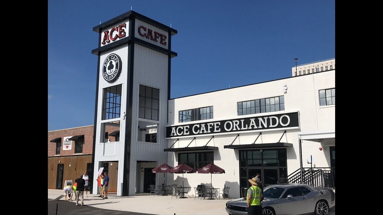 Ace Cafe Orlando building exterior with a tall tower and outdoor seating.