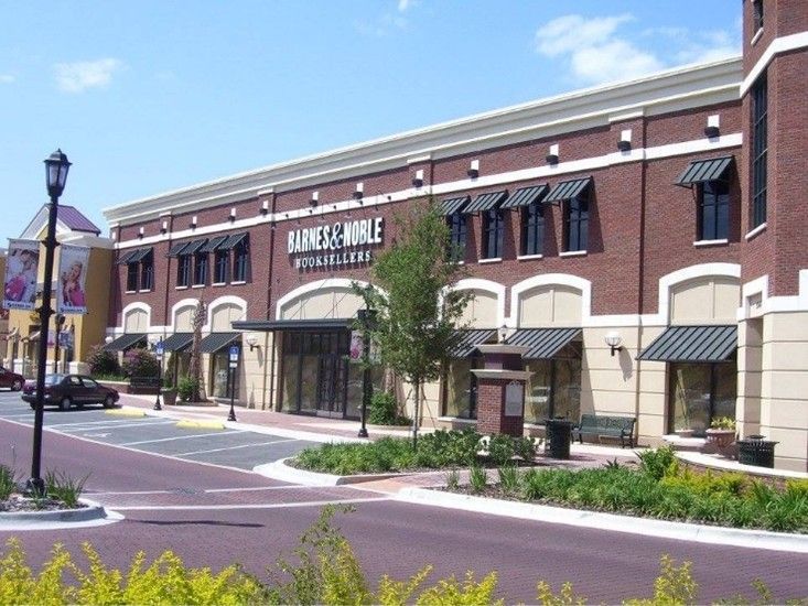 Professionally installed metal awnings on a bookstore exterior. Professionally installed metal awnings on a bookstore exterior.