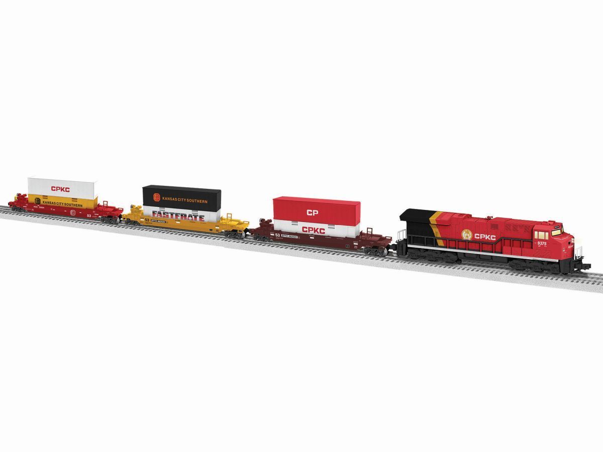 Red model freight train with three cars on tracks against a white background