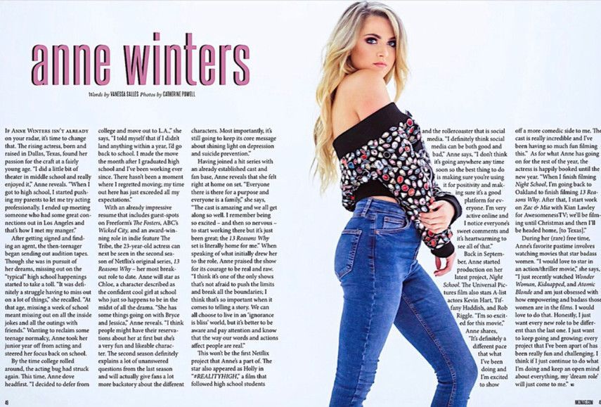 A woman in a sweater and jeans is on the cover of a magazine.