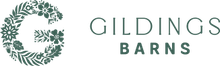 The logo for gildings barns has a floral wreath around the letter g.