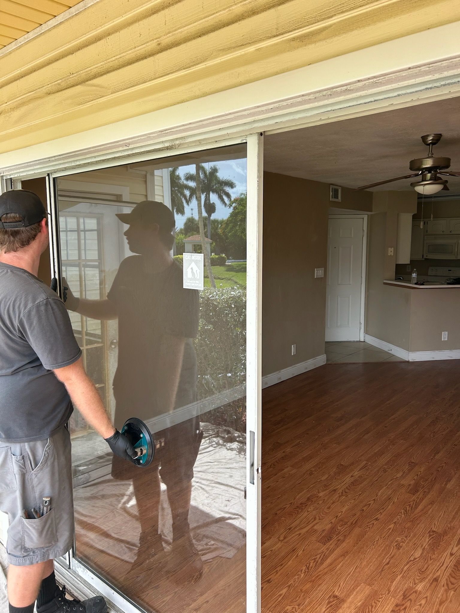 Professional sliding glass door installation with complete frame replacement in a Florida home