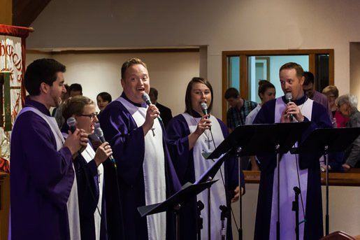 Five singers in purple robes.