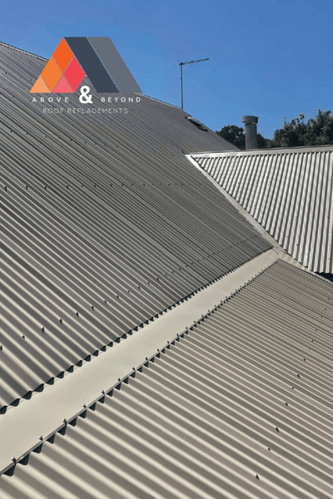 A Close Up Of A Roof With A Blue Sky In The Background – Melbourne, VIC - Above & Beyond Roof Replacements