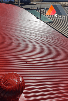 A Red Roof With A Red Wind Turbine On It – Melbourne, VIC - Above & Beyond Roof Replacements