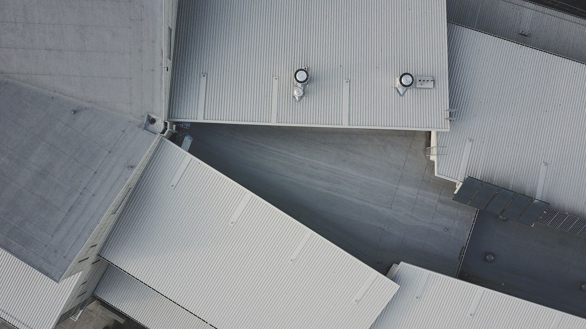 An Aerial View Of A Warehouse With A Roof That Has Fallen Down – Melbourne, VIC - Above & Beyond Roof Replacements