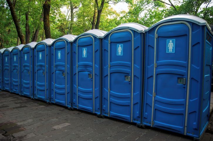 A person is cleaning a camper with a screwdriver.