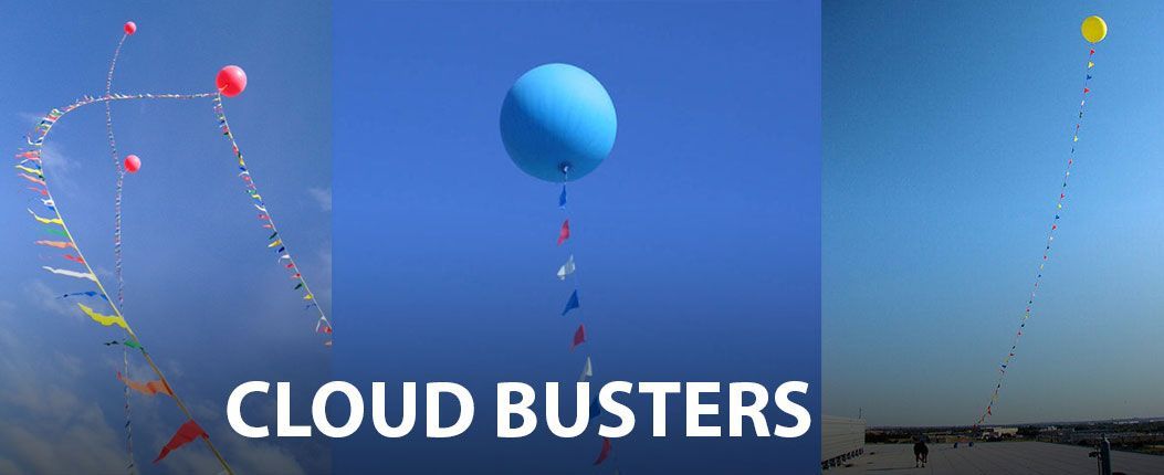 A blue balloon is flying in the sky with the words cloud busters below it