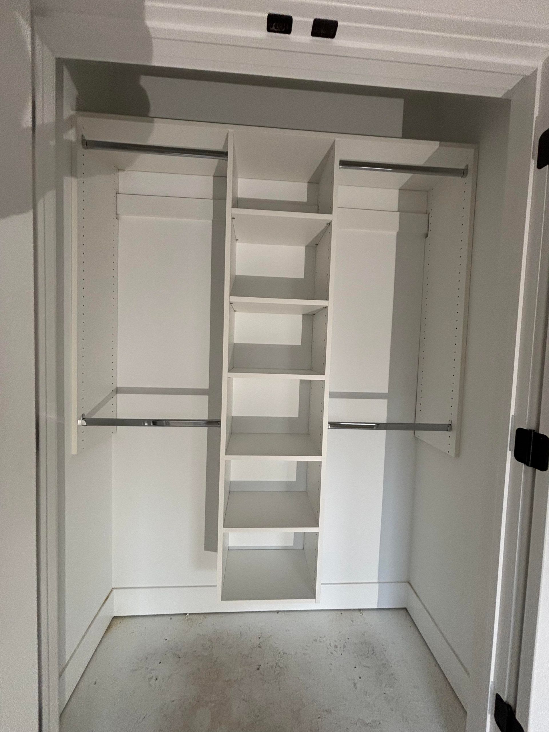 A closet with a ladder and shelves in it