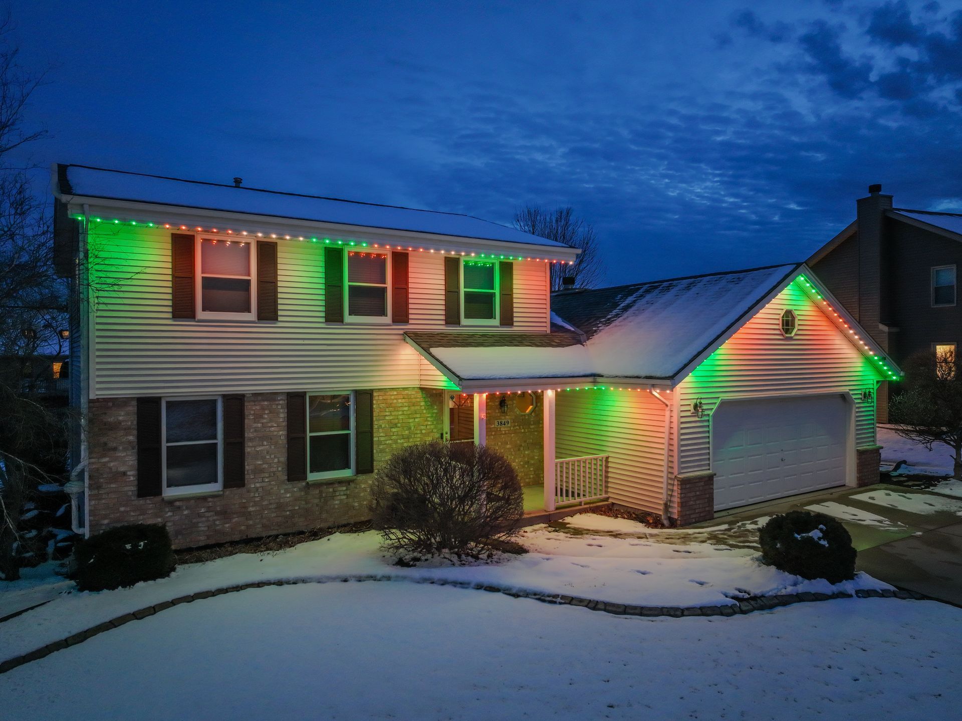 A house very colorful covered in snow.