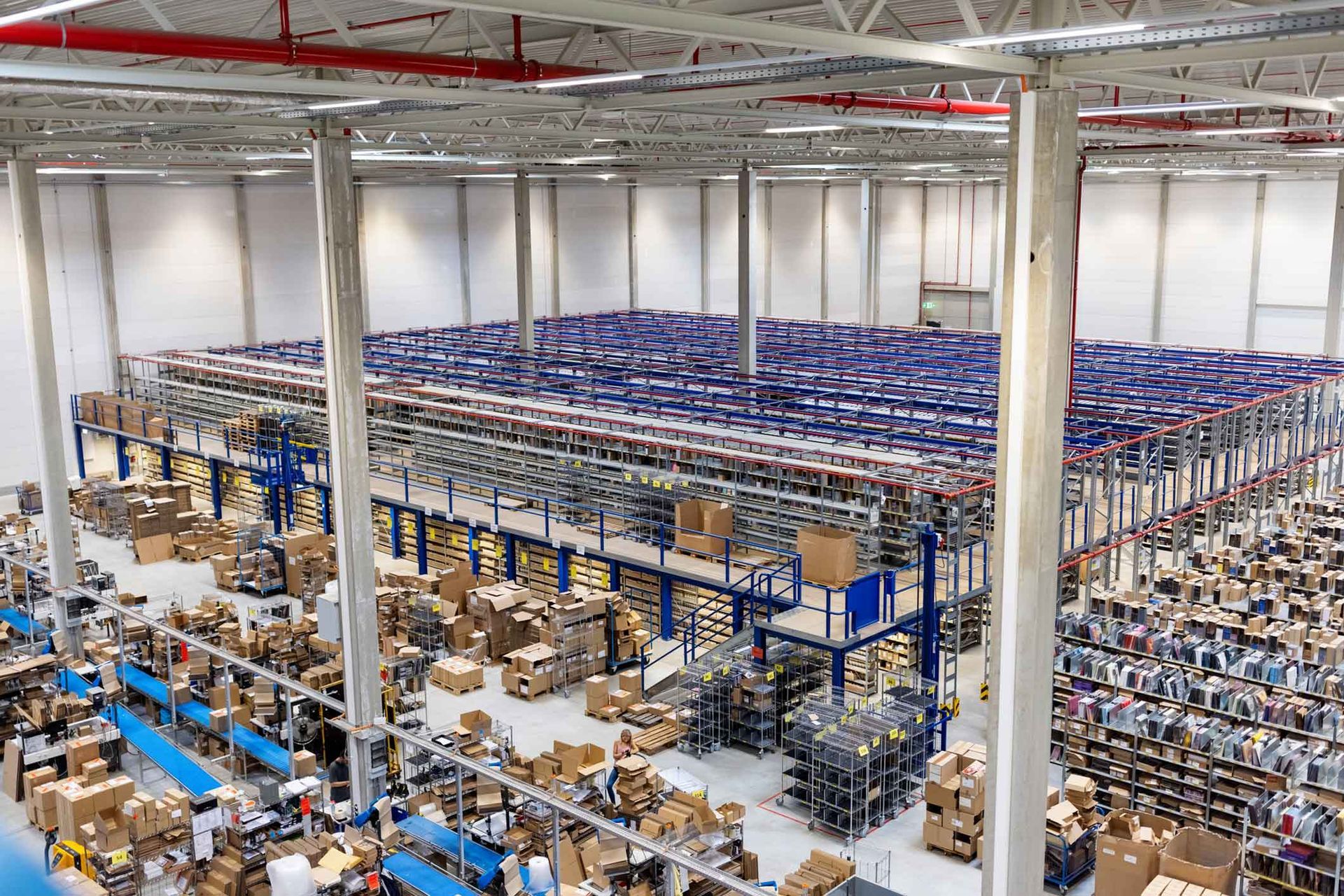 An aerial view of a large warehouse filled with lots of boxes.