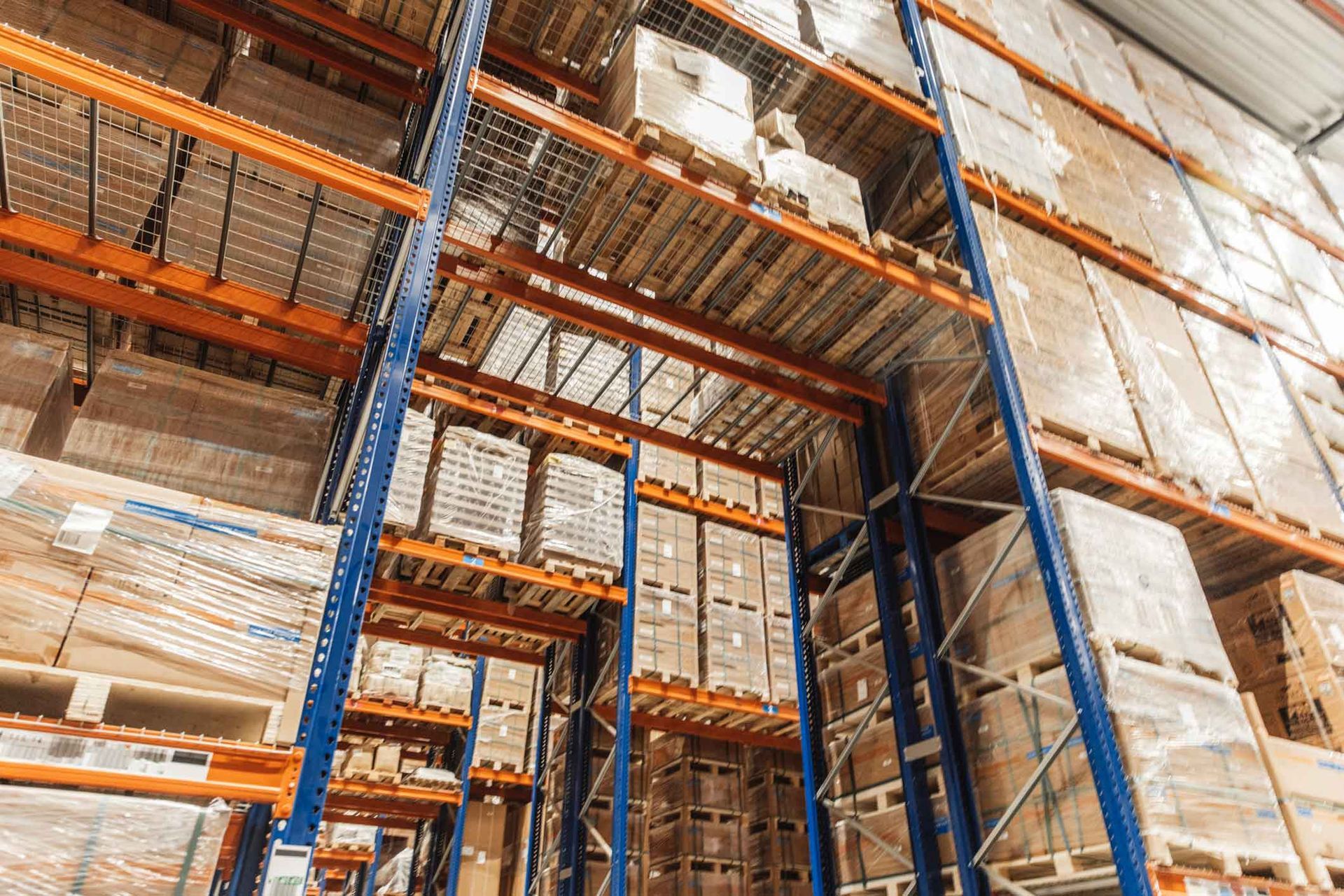 A large warehouse filled with lots of boxes and shelves.