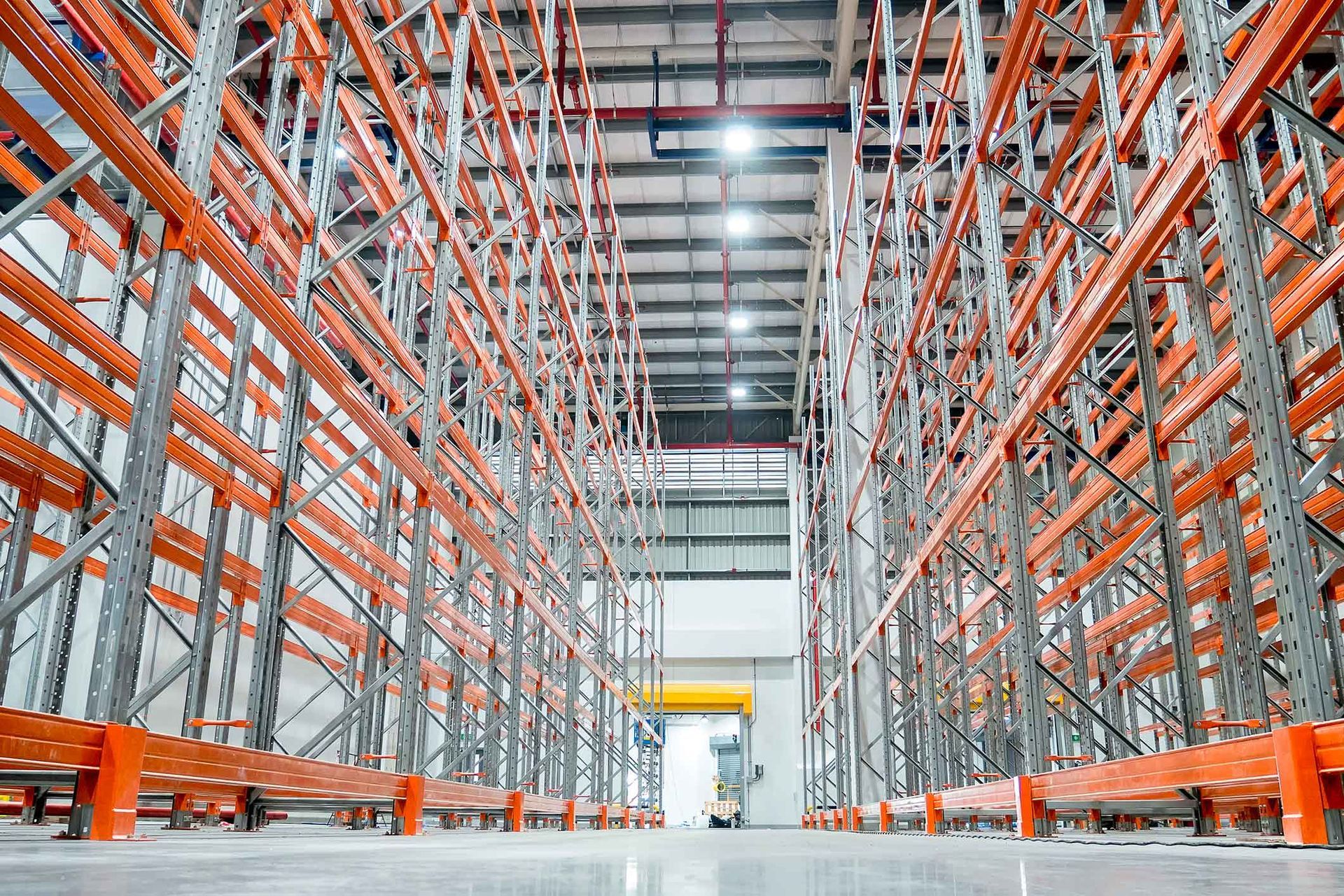 A large warehouse filled with lots of shelves and racks.